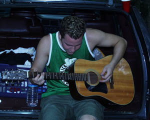 an alien playing guitar